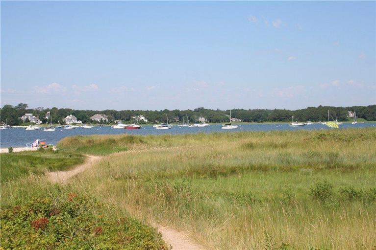 61 Parker Road Osterville, MA 02655 - Photo 3 of 19 a view of a lake with houses in the back