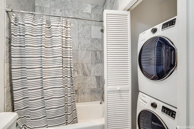 a view of a hallway with washer and dryer