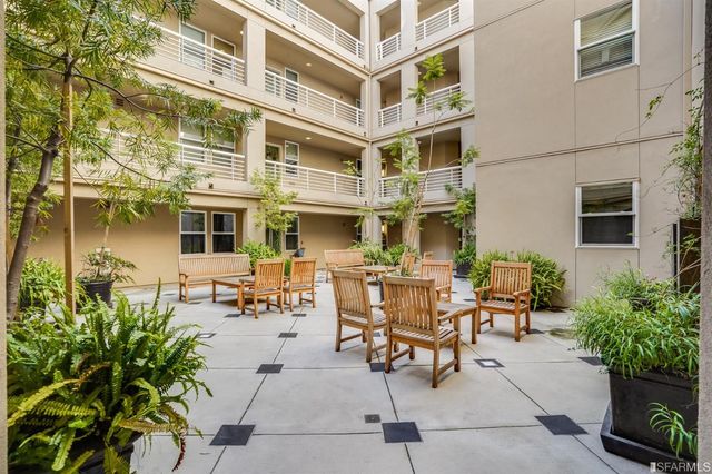 a view of a building with sitting area