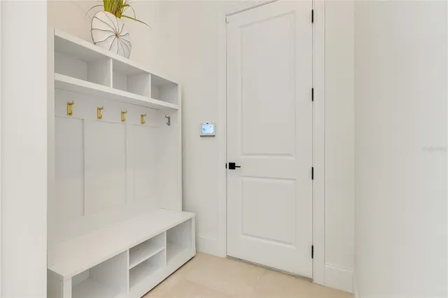 a bathroom with a toilet a sink a mirror a bathtub and vanity