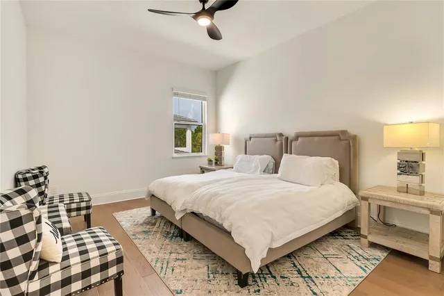 a view of a swimming pool with a porch and sitting area