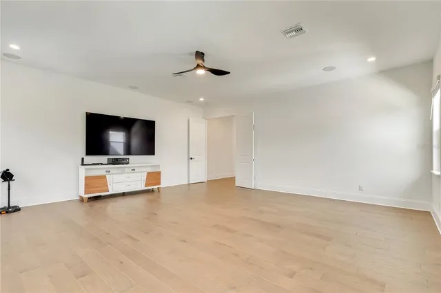 a bathroom with a sink toilet vanity and shower