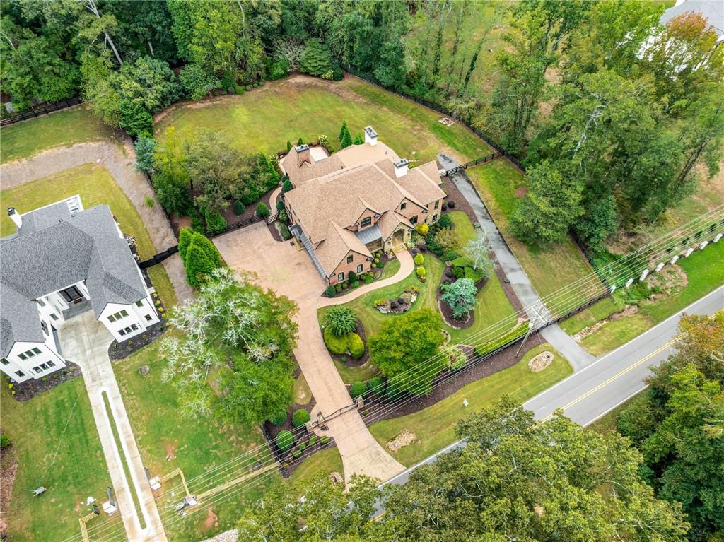 16050 South Thompson Road Milton, GA 30004 - Photo 71 of 72 an aerial view of a house with a yard basket ball court and outdoor seating