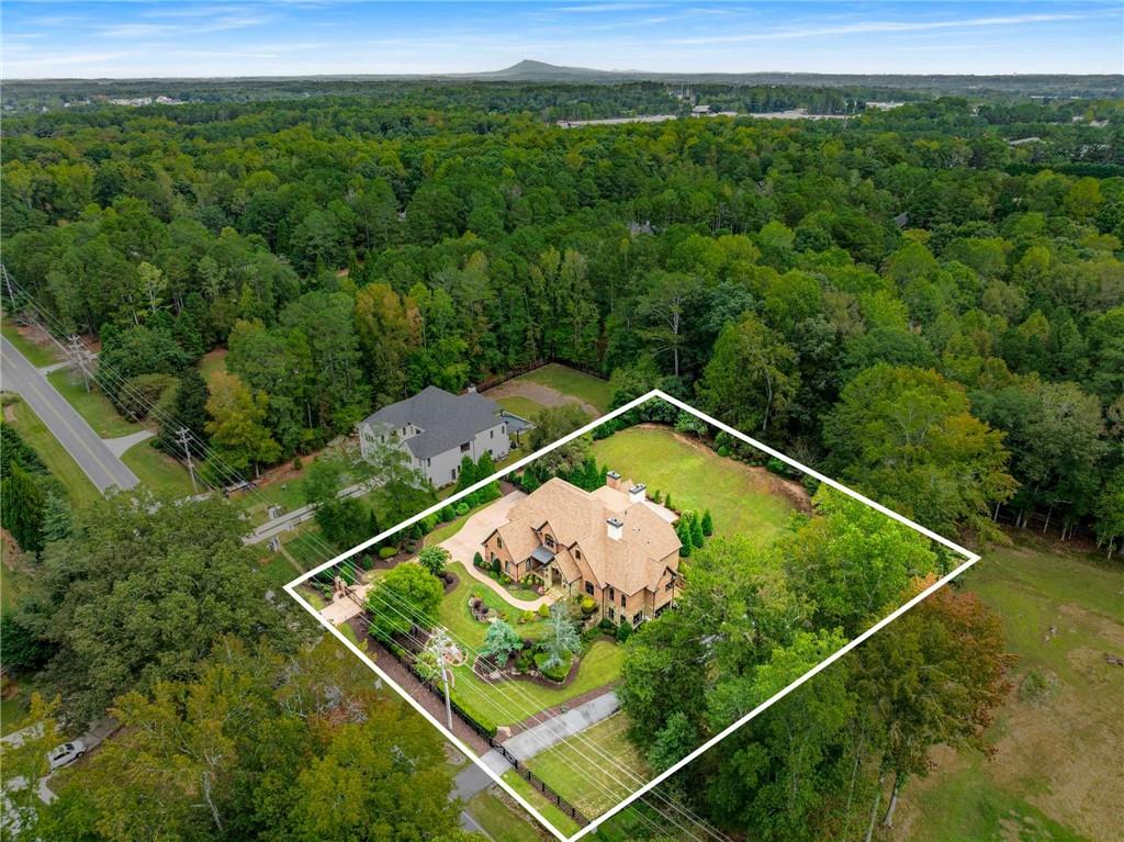 16050 South Thompson Road Milton, GA 30004 - Photo 10 of 72 a view of a tennis court