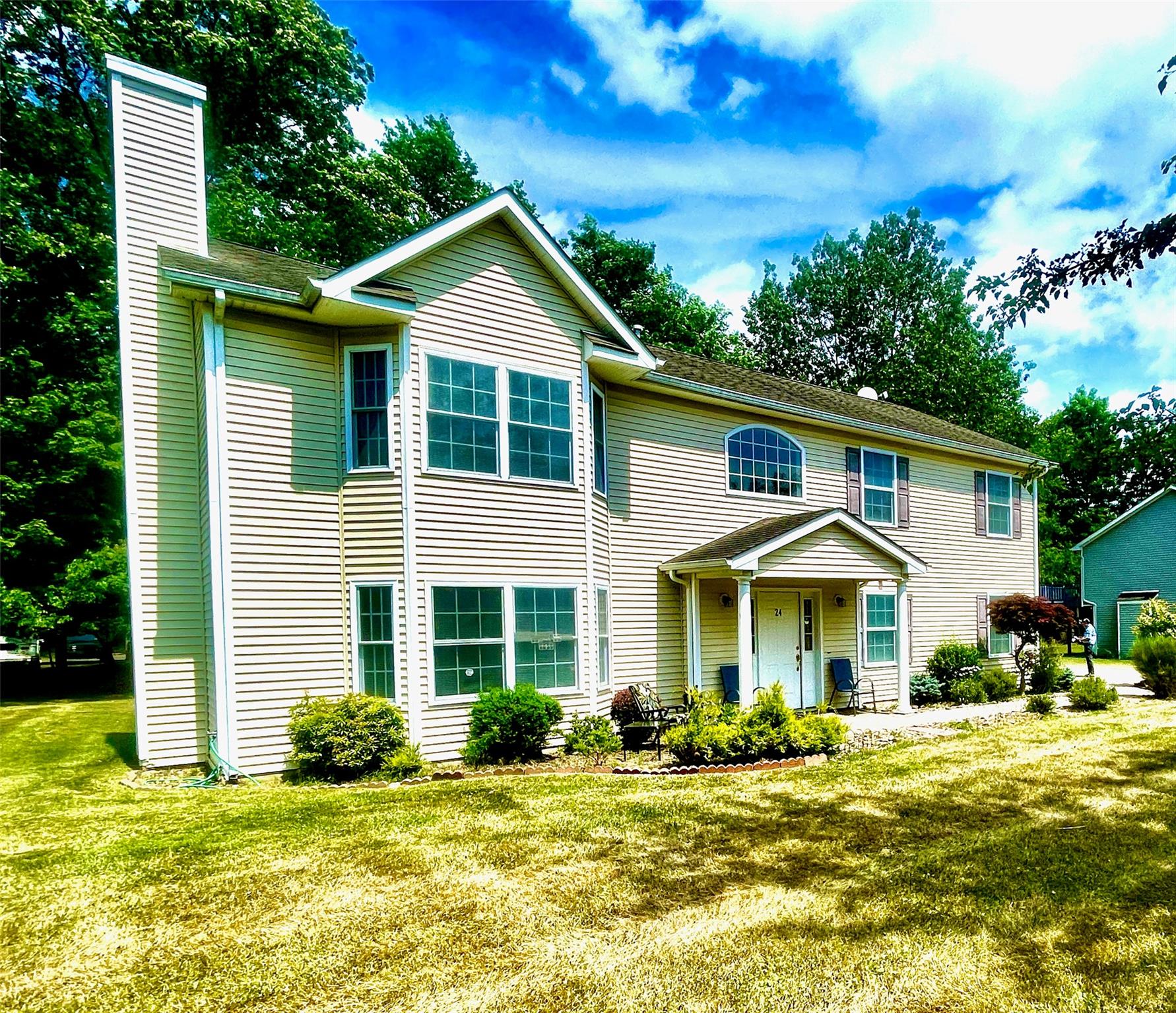 a front view of a house with a yard