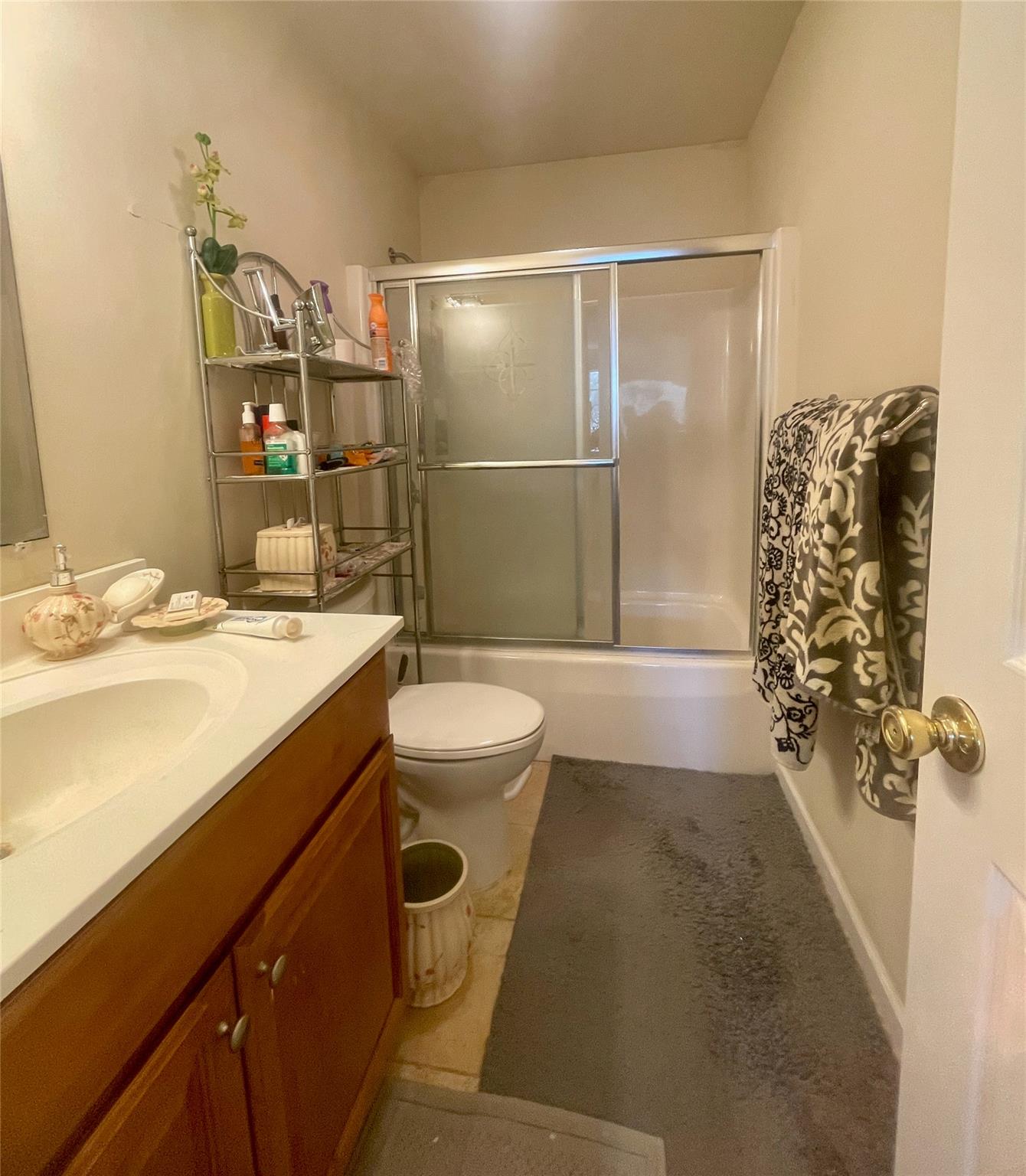 24 3rd Street Middletown, NY 10940 - Photo 20 of 34 a bathroom with a sink a toilet and shower