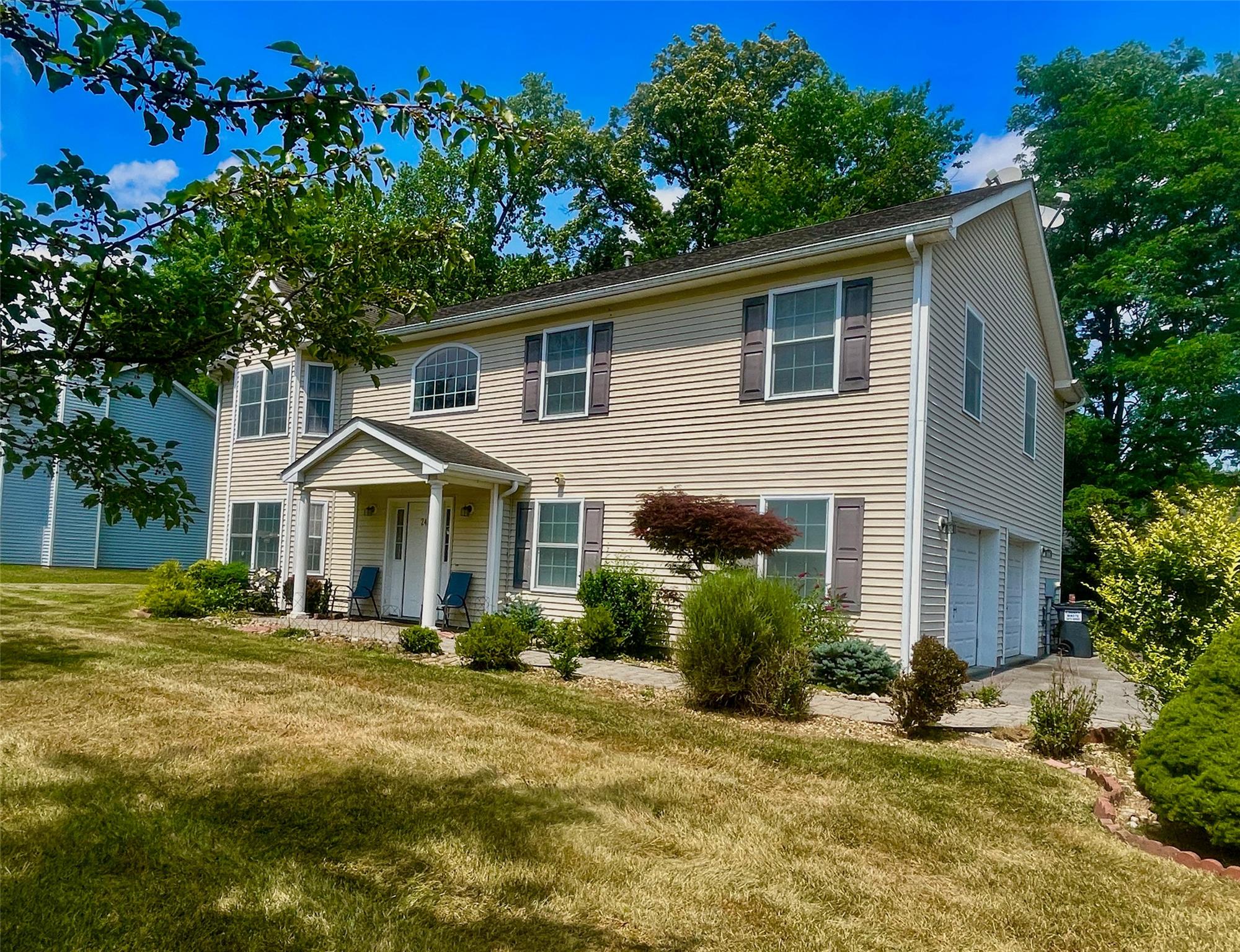 24 3rd Street Middletown, NY 10940 - Photo 2 of 34 a front view of a house with a yard
