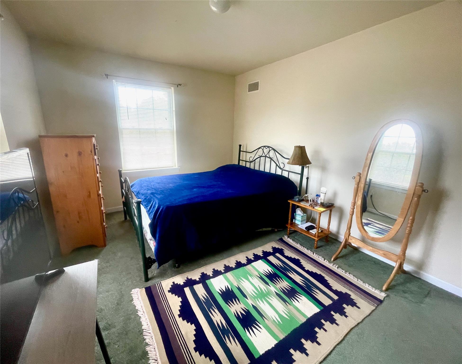 24 3rd Street Middletown, NY 10940 - Photo 21 of 34 a bed sitting in a bedroom next to a window
