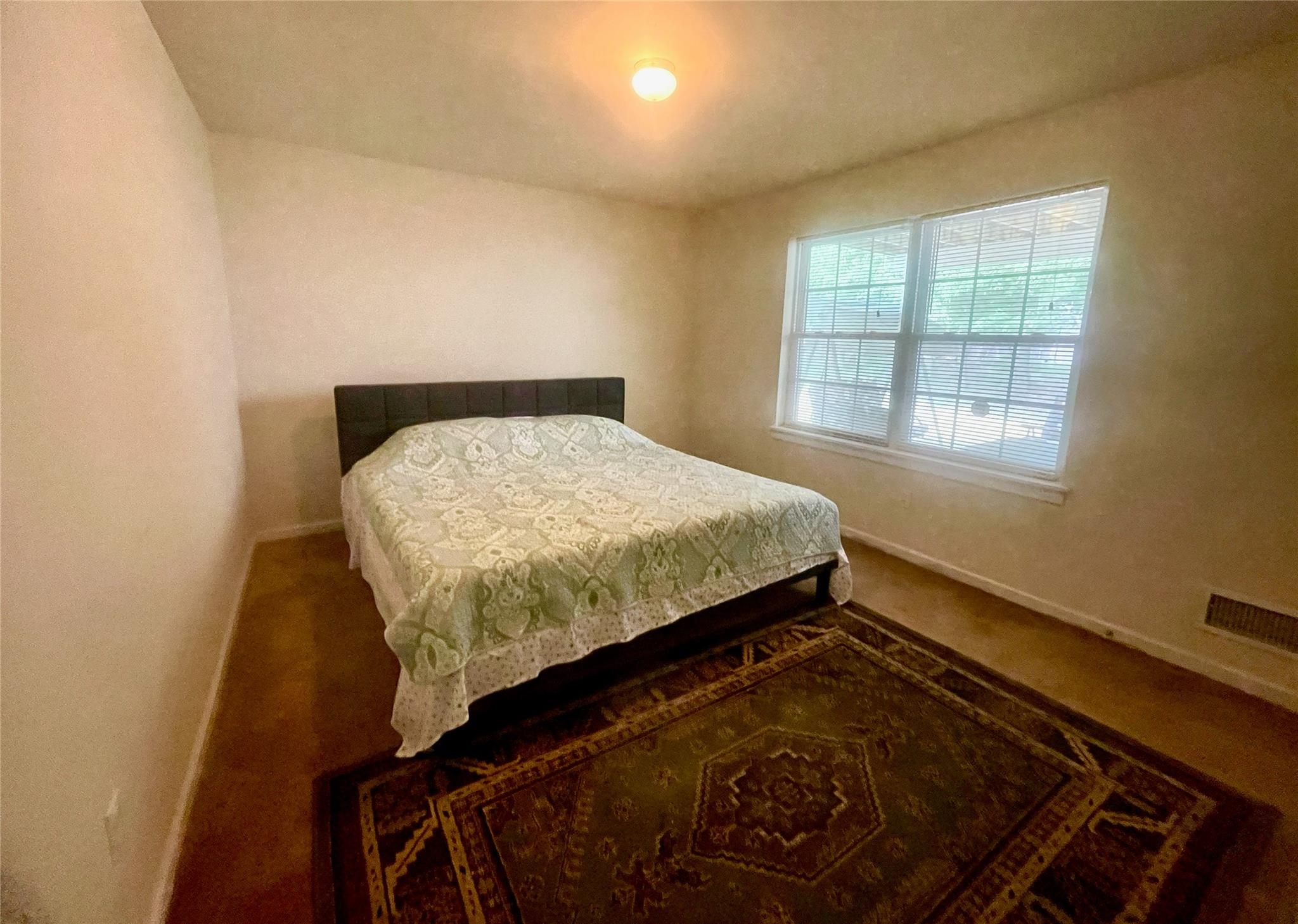 24 3rd Street Middletown, NY 10940 - Photo 26 of 34 a bed sitting in a bedroom next to a window
