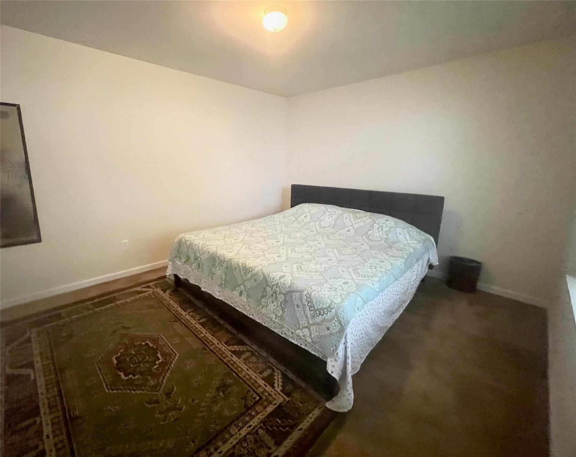 24 3rd Street Middletown, NY 10940 - Photo 27 of 34 a bed sitting in a bedroom next to a window