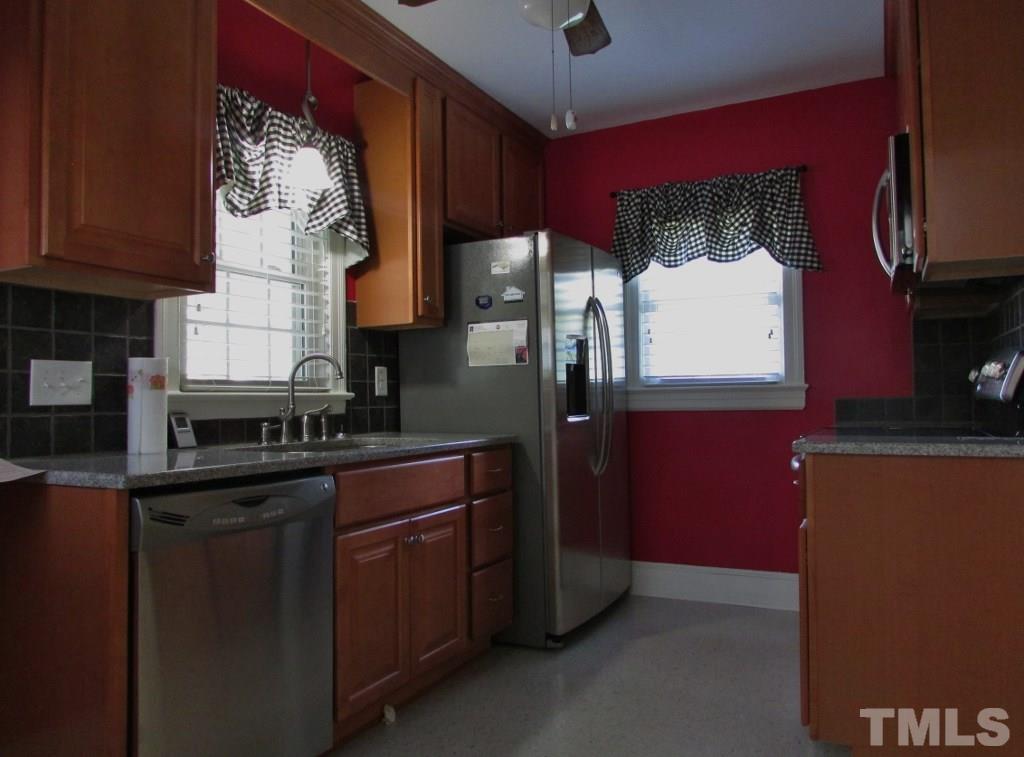 511 Chub Lake Street Roxboro, NC 27573 - Photo 2 of 23 Compact kitchen with everything at your fingertips. New solid surface counter tops, cabinetry and stainless appliances