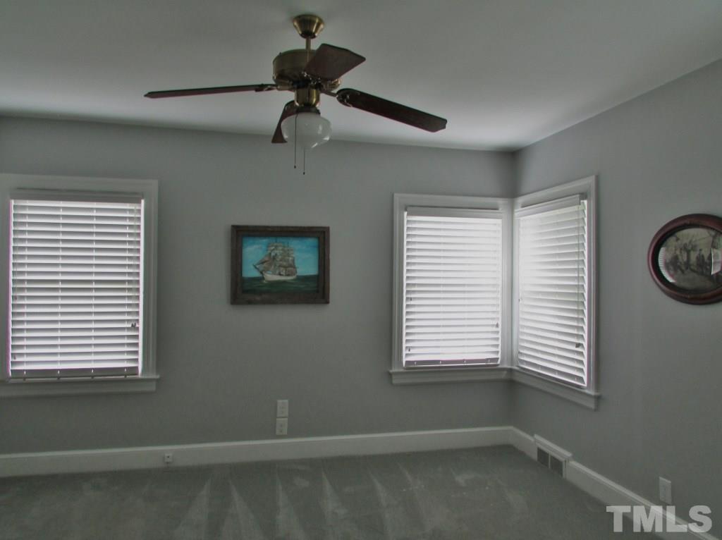 511 Chub Lake Street Roxboro, NC 27573 - Photo 11 of 23 Bedroom has carpet and also has a corner window that offer plenty of natural light.
