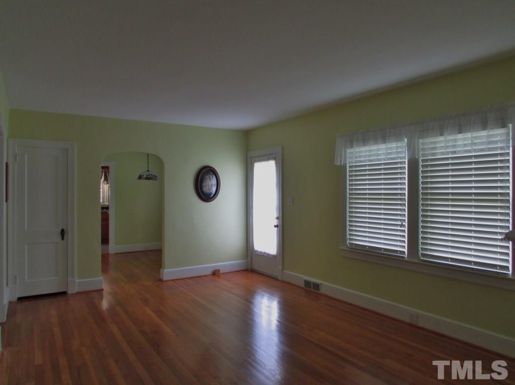 511 Chub Lake Street Roxboro, NC 27573 - Photo 5 of 23 The living room is spacious and has beautifully refinished hardwood floors