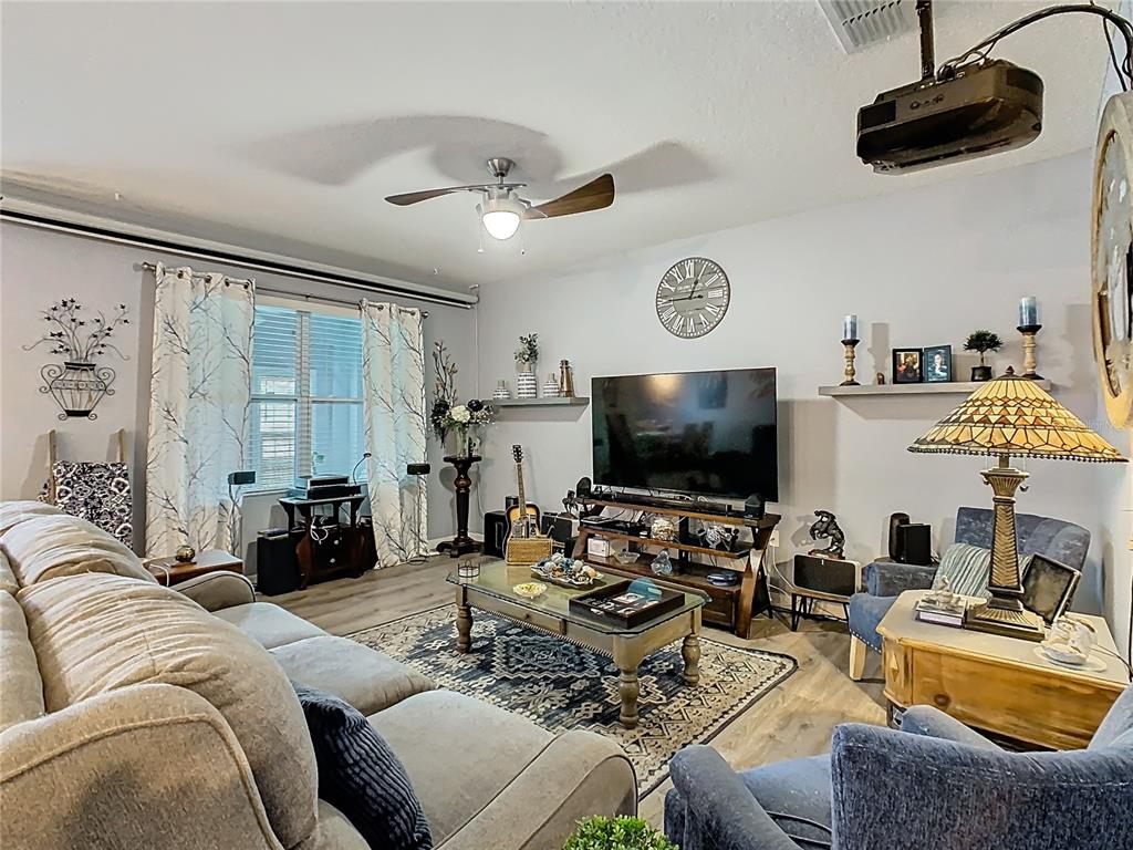 1765 Brockridge Road Kissimmee, FL 34744 - Photo 17 of 45 a living room with furniture and a flat screen tv