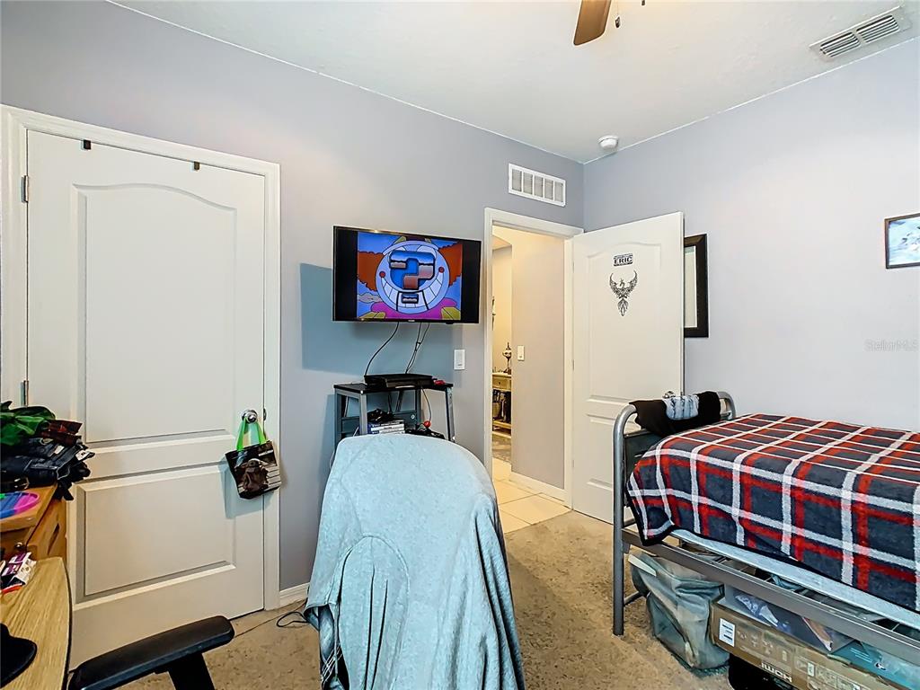 1765 Brockridge Road Kissimmee, FL 34744 - Photo 24 of 45 a bedroom with bed and a window