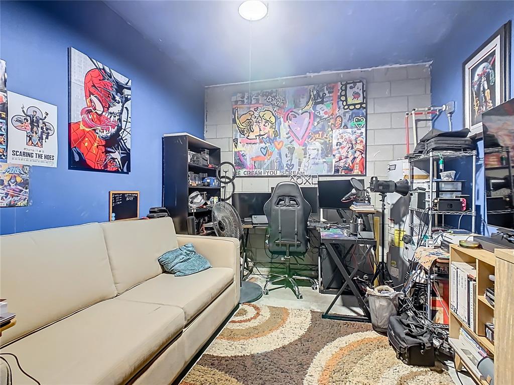 1765 Brockridge Road Kissimmee, FL 34744 - Photo 32 of 45 a living room with furniture and a flat screen tv