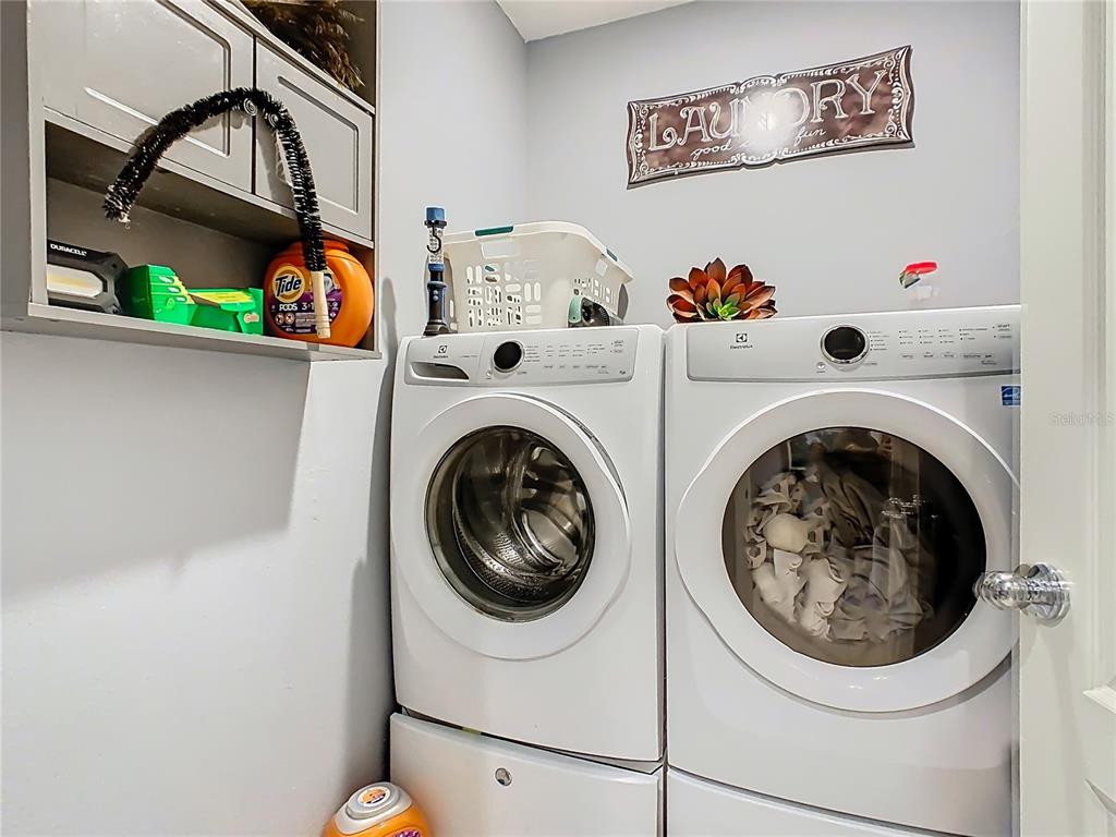 1765 Brockridge Road Kissimmee, FL 34744 - Photo 33 of 45 a utility room with dryer and washer