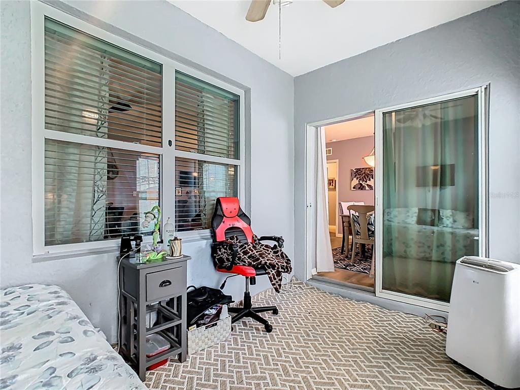 1765 Brockridge Road Kissimmee, FL 34744 - Photo 36 of 45 a room that has a couch and a potted plant