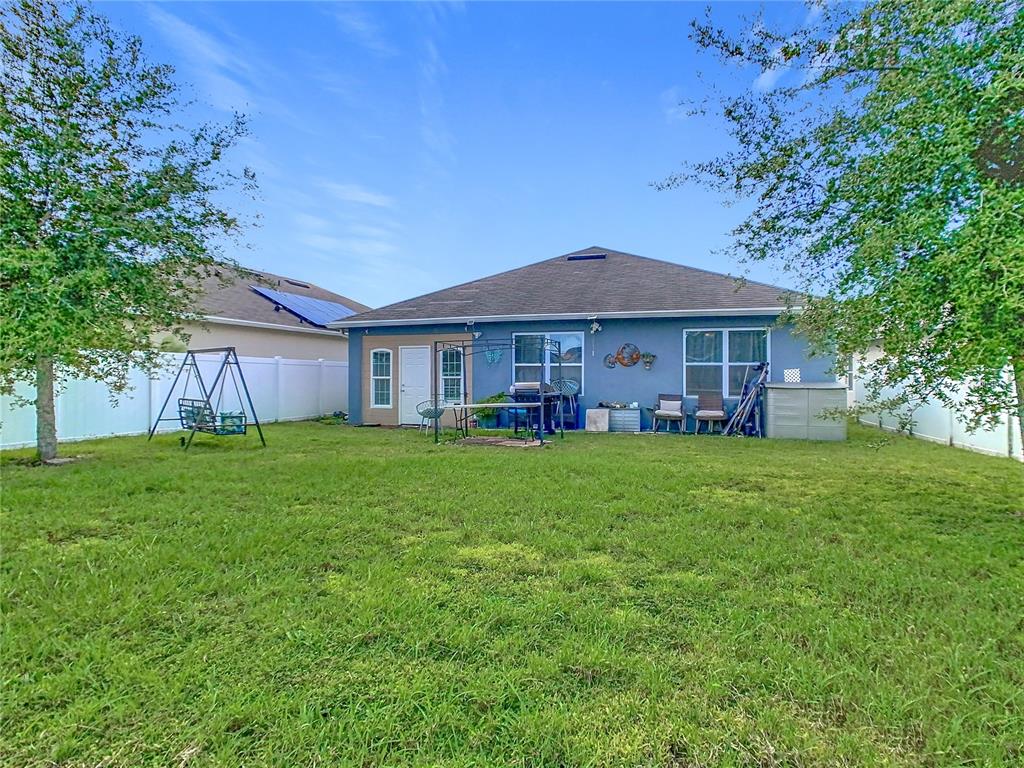 1765 Brockridge Road Kissimmee, FL 34744 - Photo 40 of 45 a front view of a house with a garden