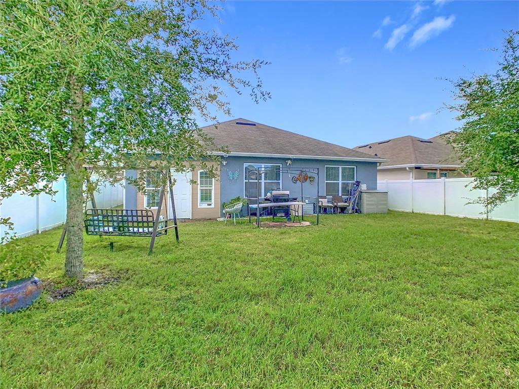 1765 Brockridge Road Kissimmee, FL 34744 - Photo 41 of 45 a house view with a sitting space and garden