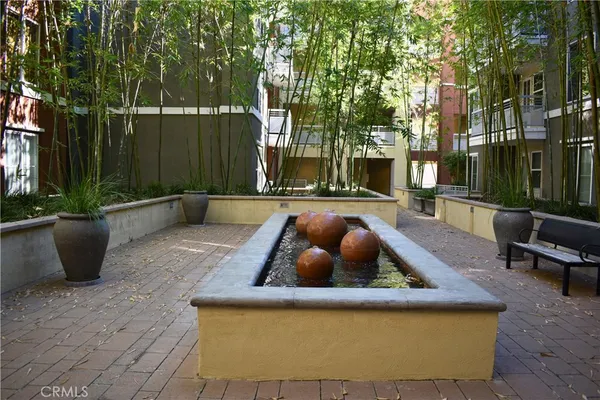 a view of a backyard with sitting area