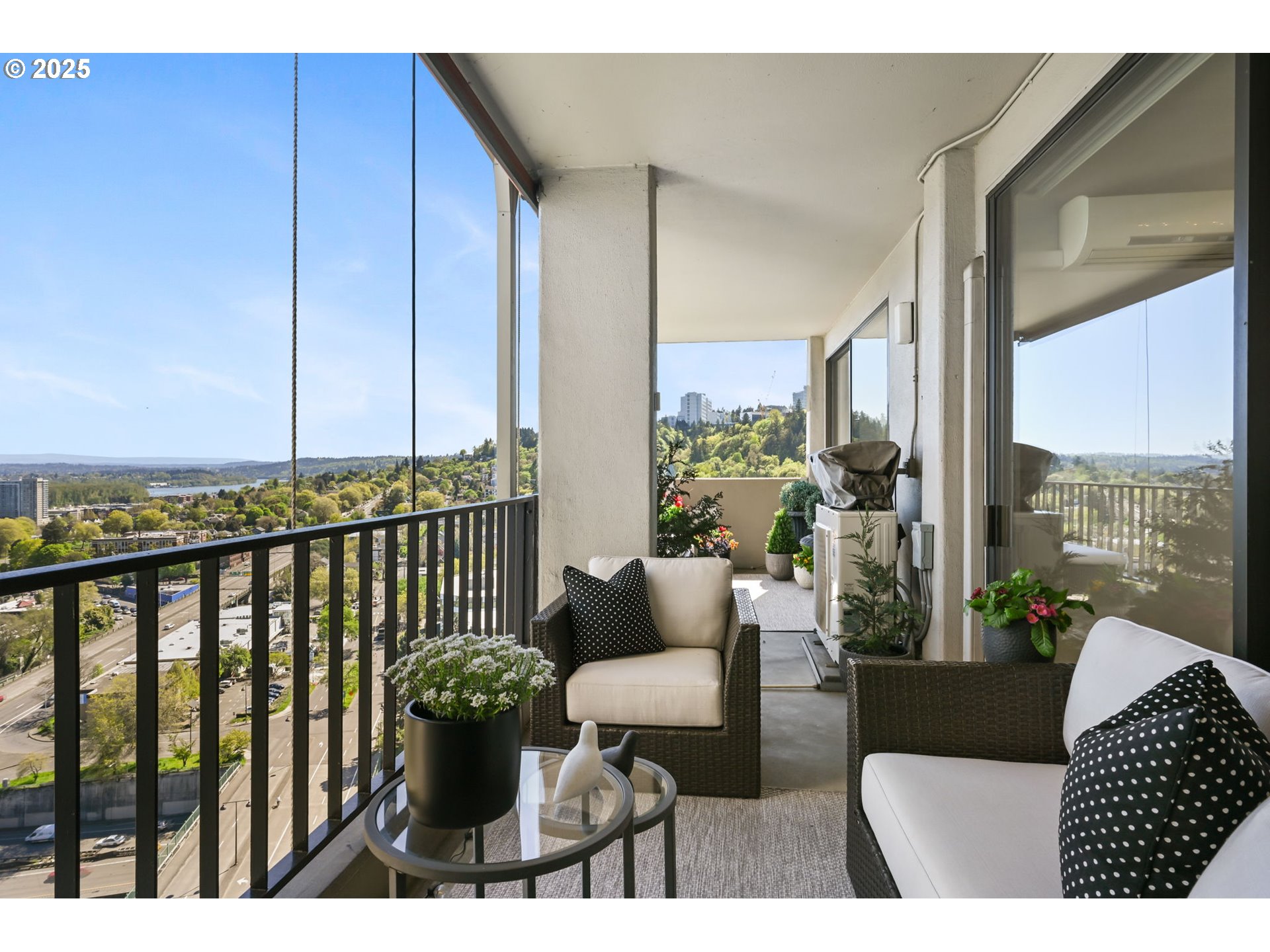 2221 Southwest 1st Avenue, Unit 2225 Portland, OR 97201 - Photo 19 of 47 a balcony with furniture and a potted plant