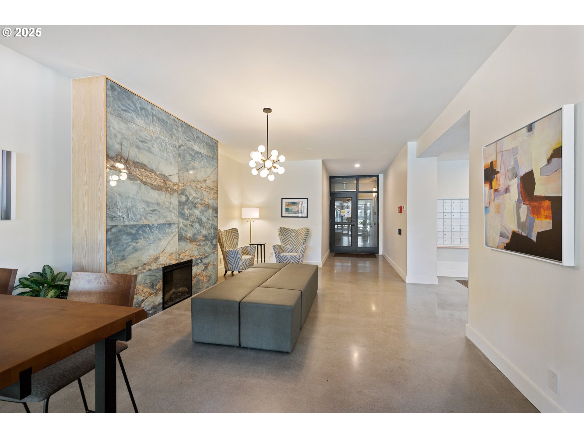 2221 Southwest 1st Avenue, Unit 2225 Portland, OR 97201 - Photo 2 of 47 a living room with furniture and a chandelier
