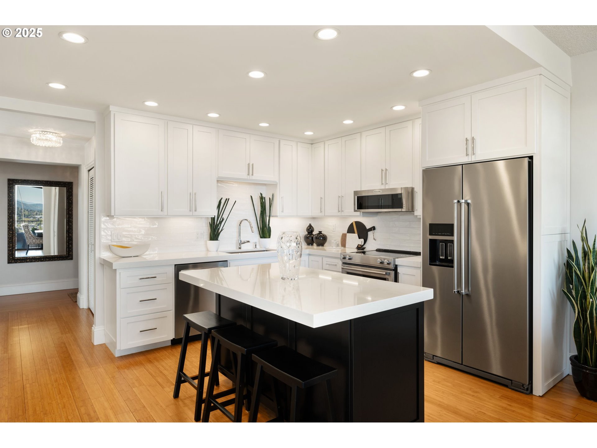 2221 Southwest 1st Avenue, Unit 2225 Portland, OR 97201 - Photo 25 of 47 a kitchen with a sink stainless steel appliances and white cabinets