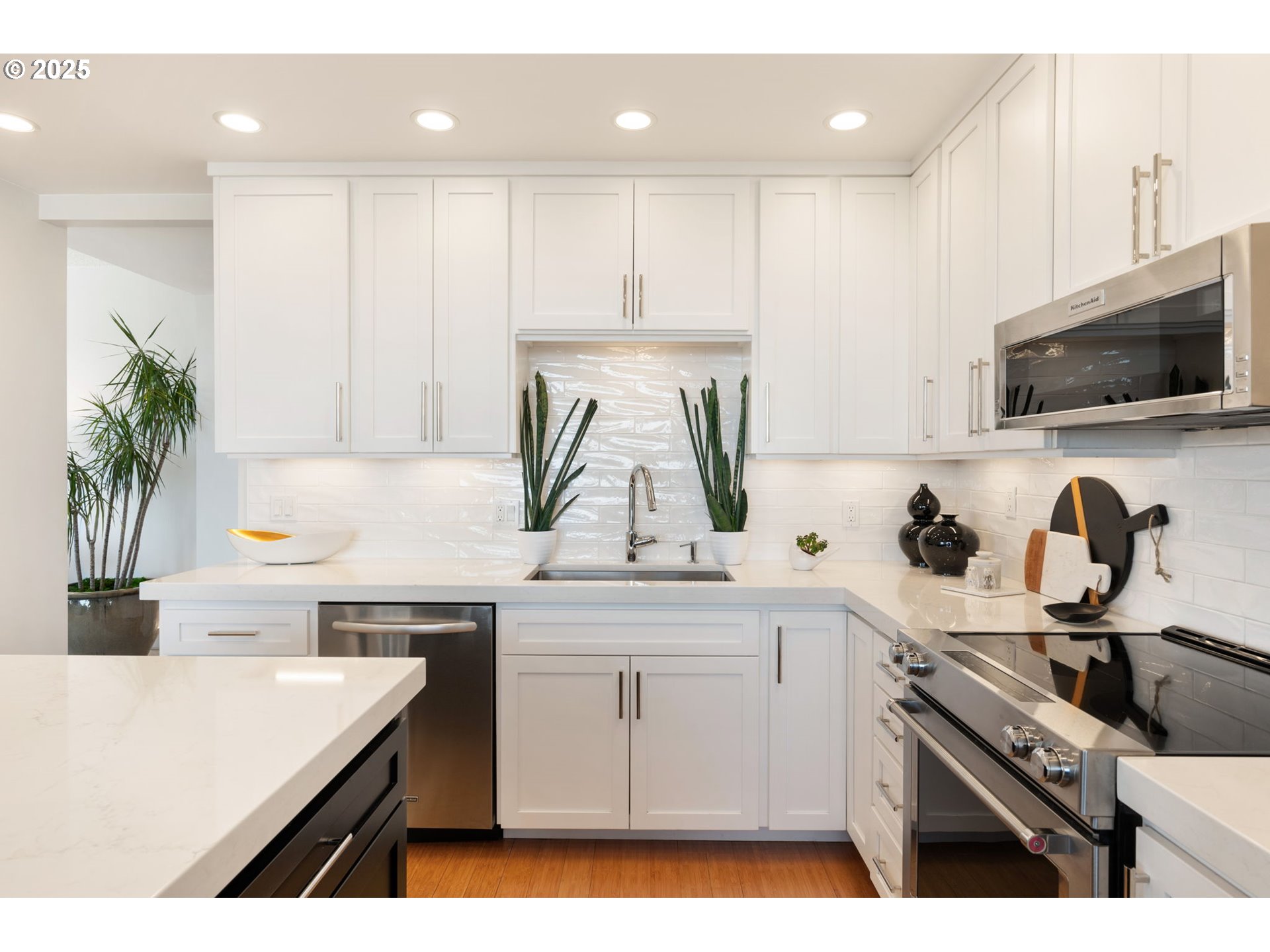 2221 Southwest 1st Avenue, Unit 2225 Portland, OR 97201 - Photo 26 of 47 a kitchen with a sink a stove and cabinets