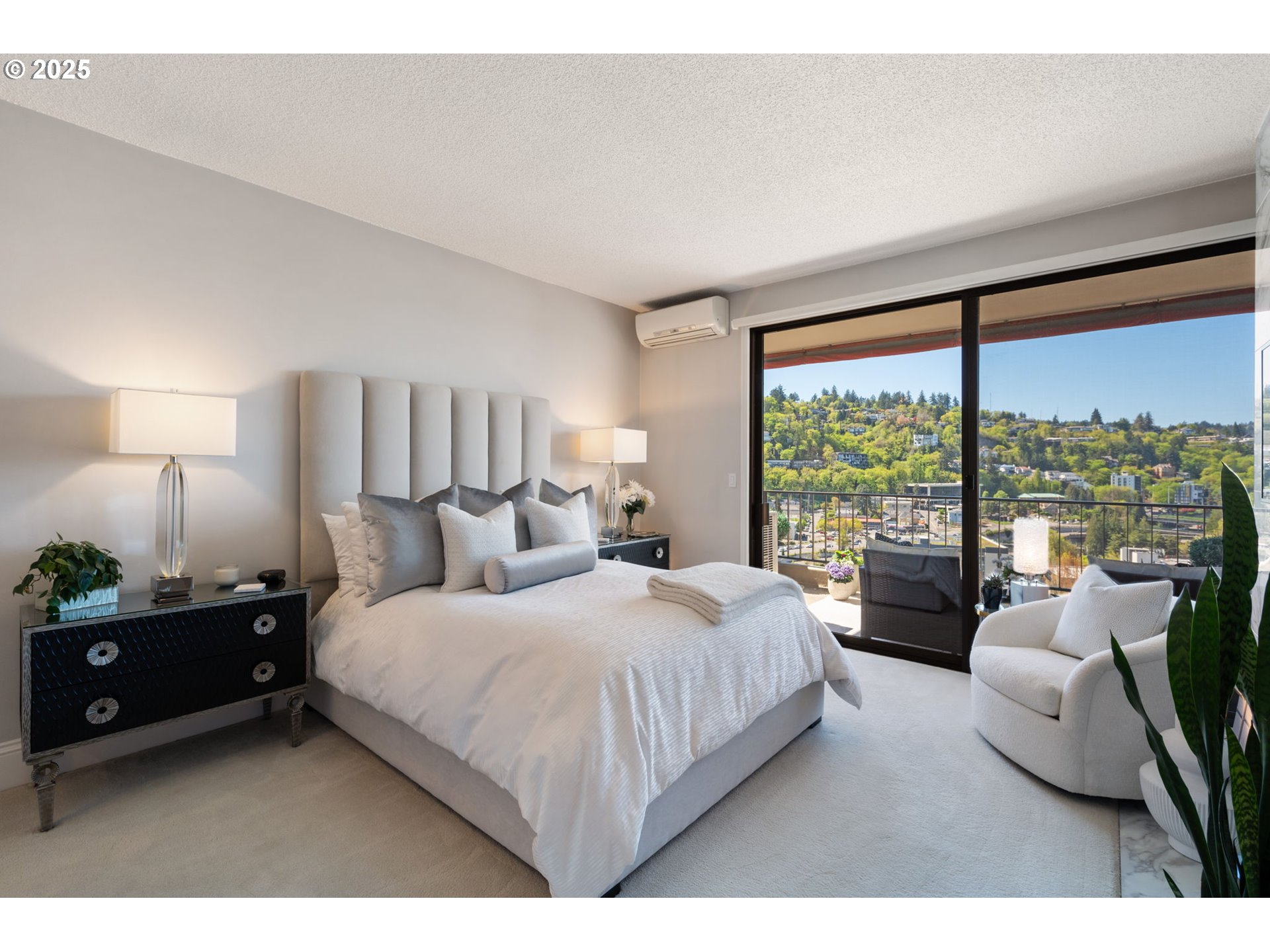 2221 Southwest 1st Avenue, Unit 2225 Portland, OR 97201 - Photo 30 of 47 a bedroom with a bed and a large window