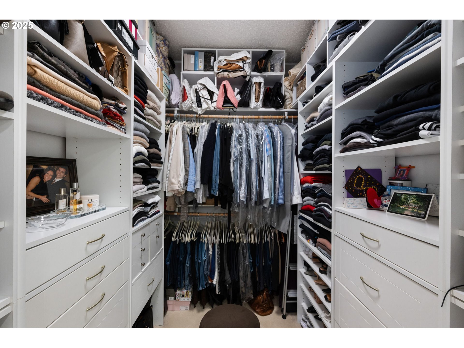 2221 Southwest 1st Avenue, Unit 2225 Portland, OR 97201 - Photo 36 of 47 a view of walk in closet with clothes and shoes