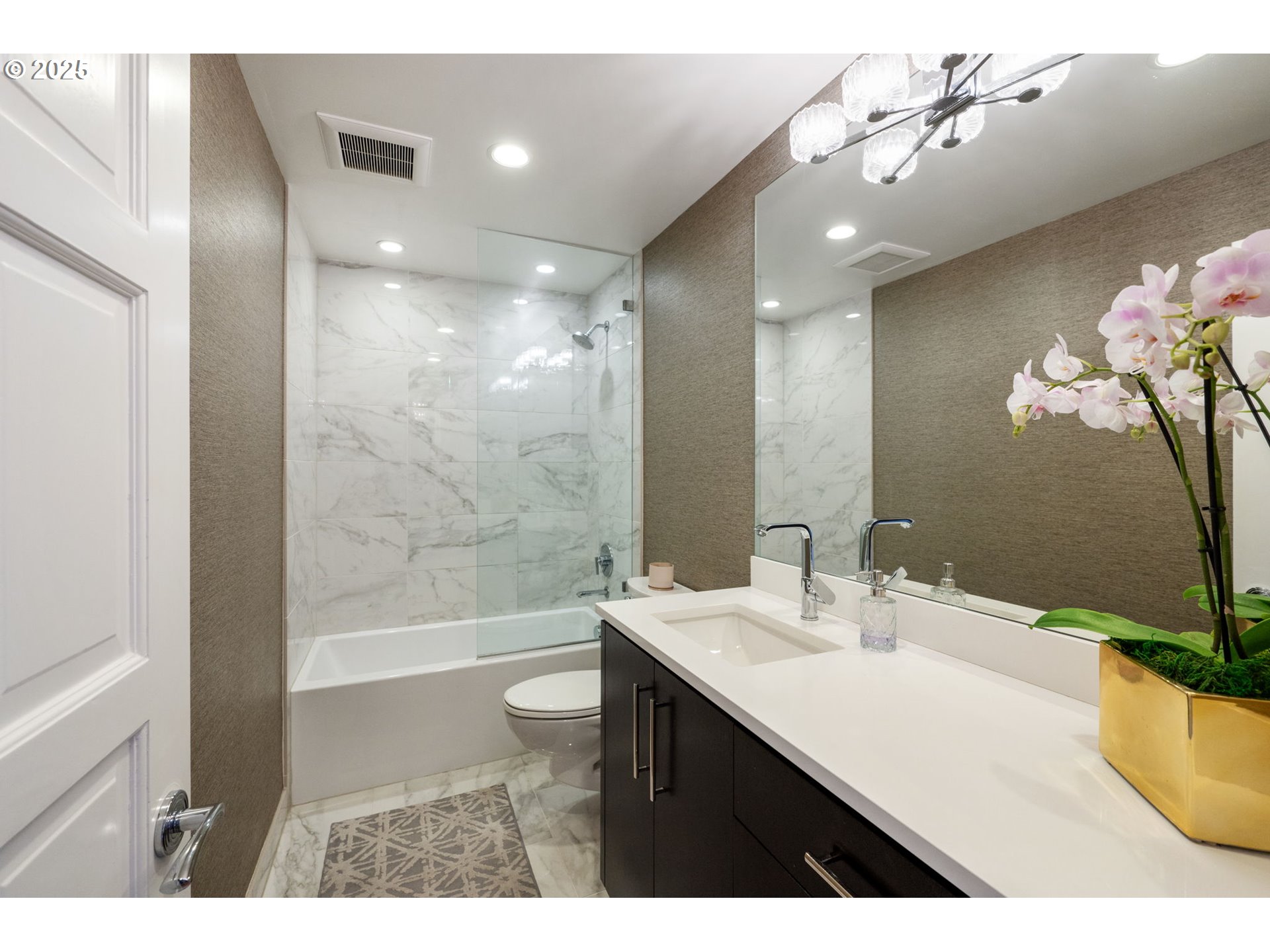 2221 Southwest 1st Avenue, Unit 2225 Portland, OR 97201 - Photo 40 of 47 a bathroom with a sink a large mirror and shower