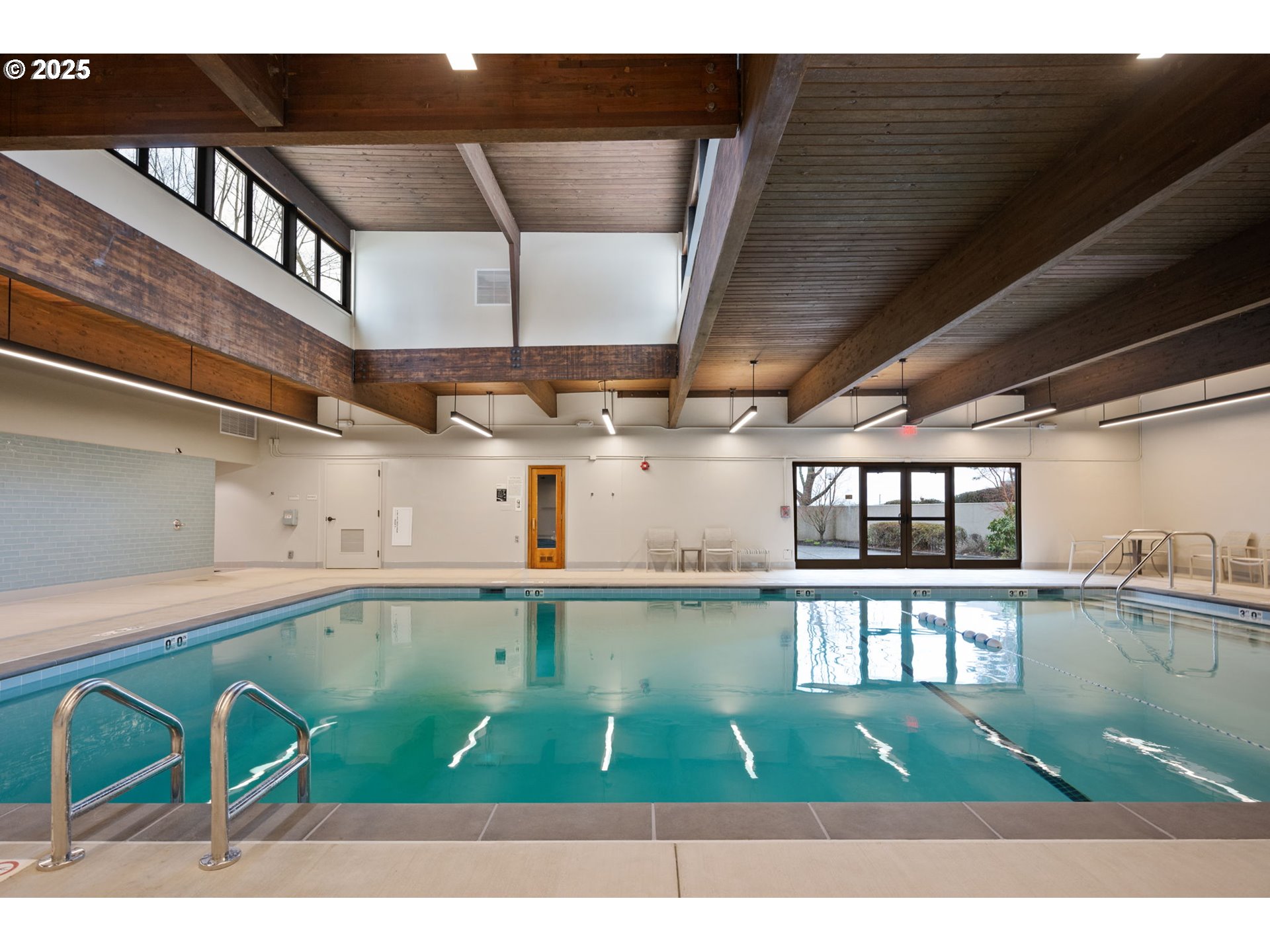2221 Southwest 1st Avenue, Unit 2225 Portland, OR 97201 - Photo 42 of 47 a open kitchen with a table and chairs