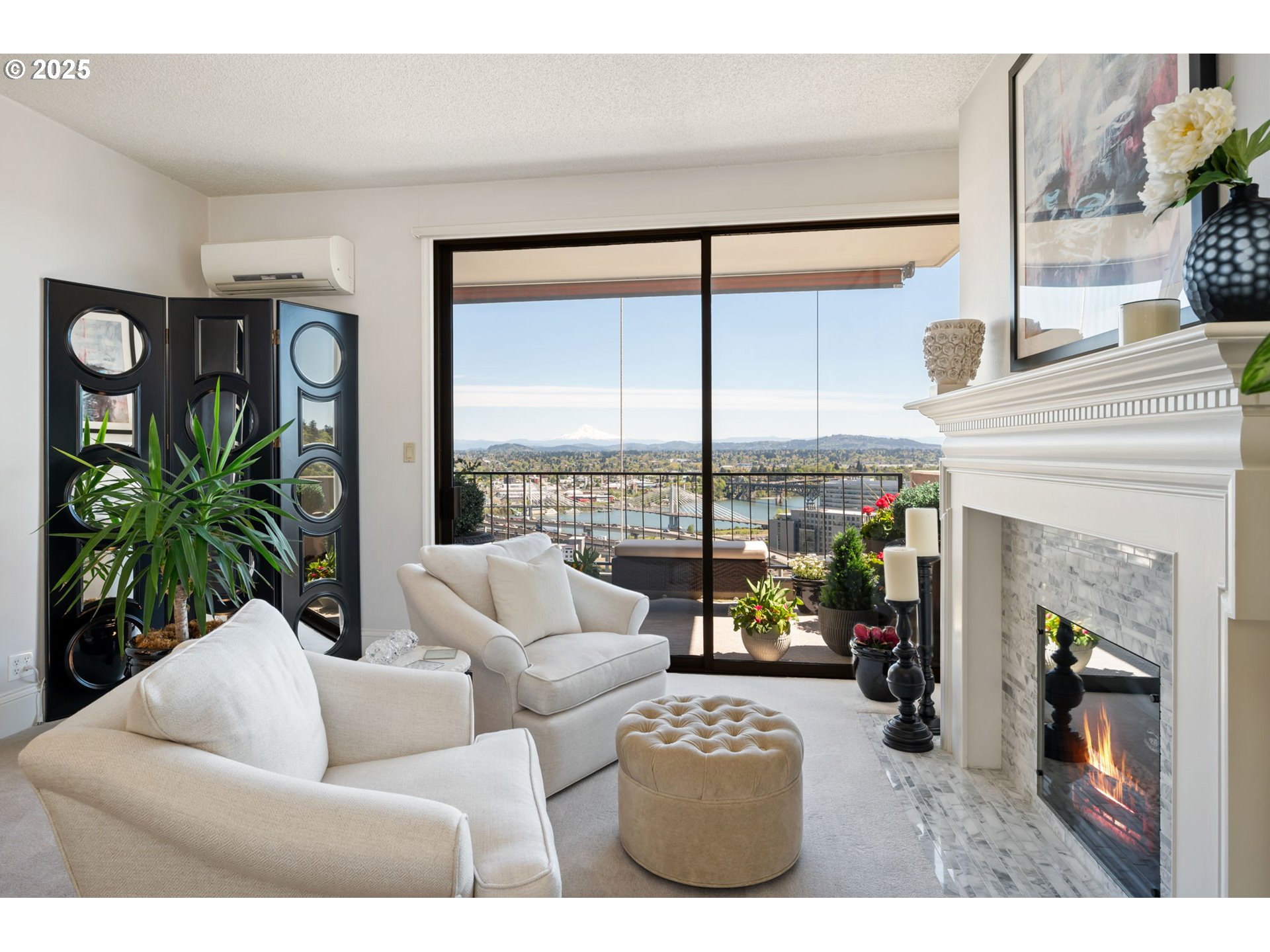 2221 Southwest 1st Avenue, Unit 2225 Portland, OR 97201 - Photo 10 of 47 a living room with furniture a fireplace and a floor to ceiling window