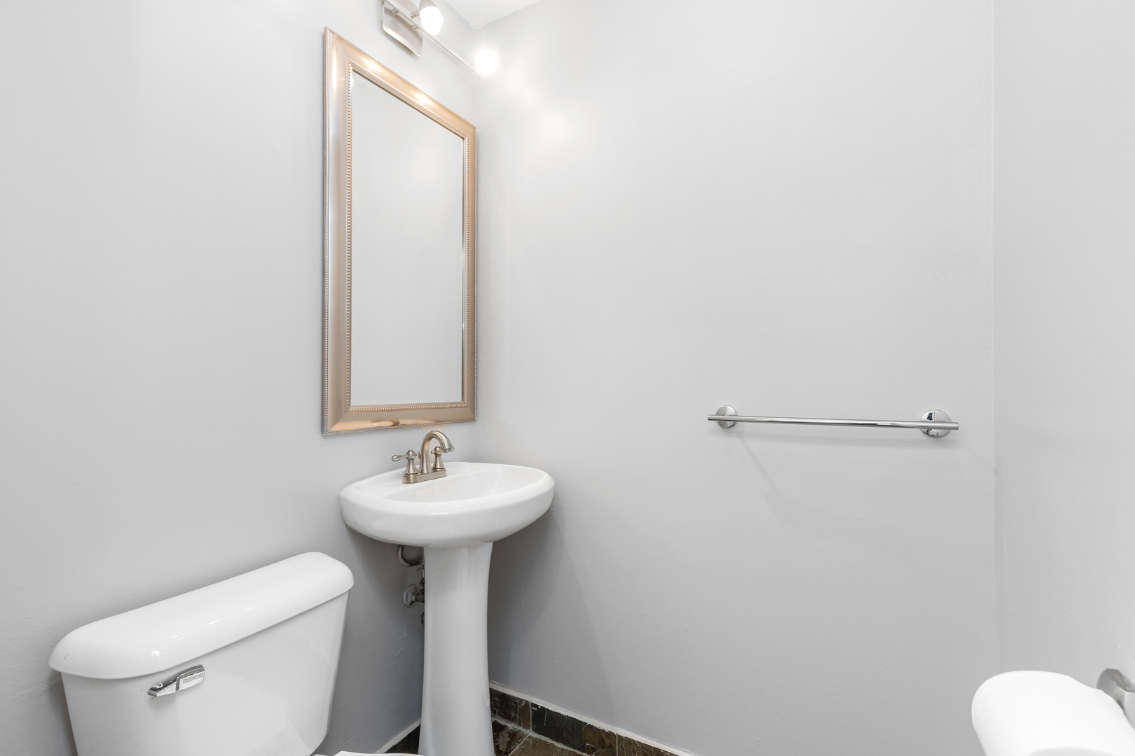 2008 Maple Avenue Northbrook, IL 60062 - Photo 11 of 16 a bathroom with a sink toilet and a mirror