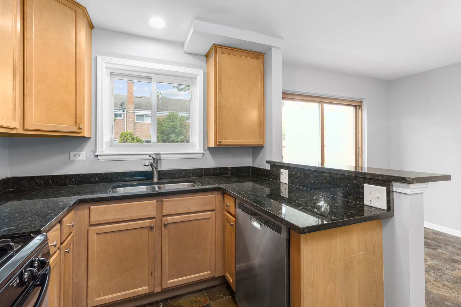 2008 Maple Avenue Northbrook, IL 60062 - Photo 3 of 16 a kitchen with granite countertop cabinets sink and window