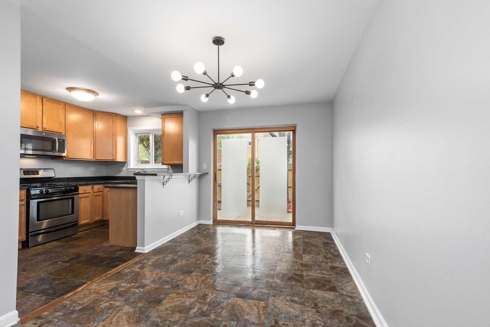 2008 Maple Avenue Northbrook, IL 60062 - Photo 5 of 16 a view of a kitchen with a sink a refrigerator and window