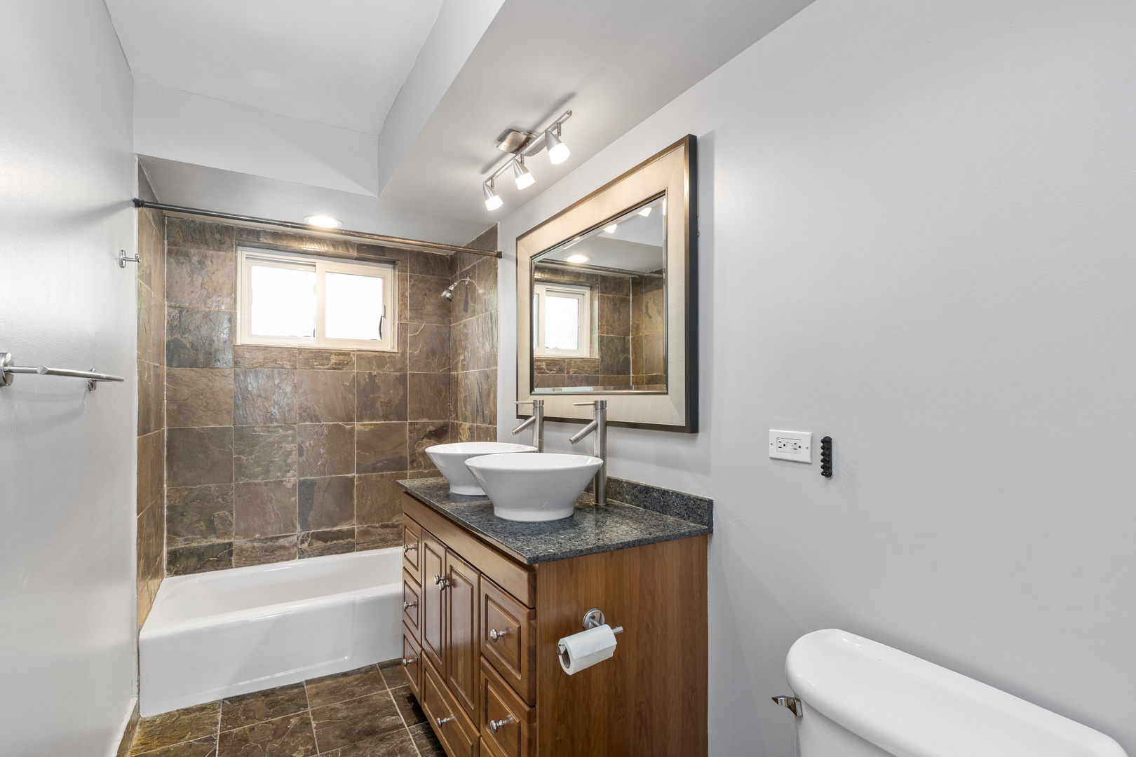 2008 Maple Avenue Northbrook, IL 60062 - Photo 9 of 16 a bathroom with a sink a toilet and shower