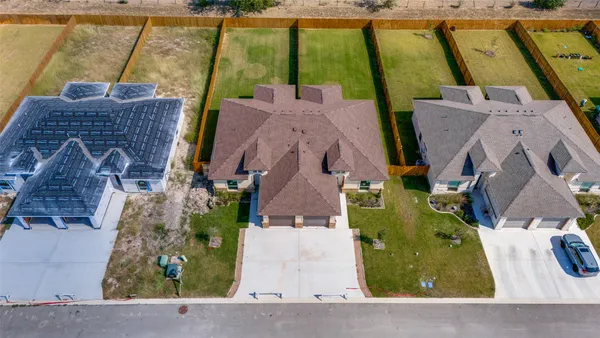 an aerial view of a house with a swimming pool
