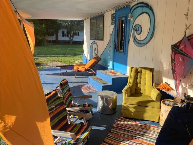 a living room with furniture and a garden