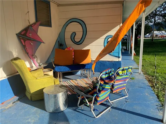 a room that has a bed and a table in it