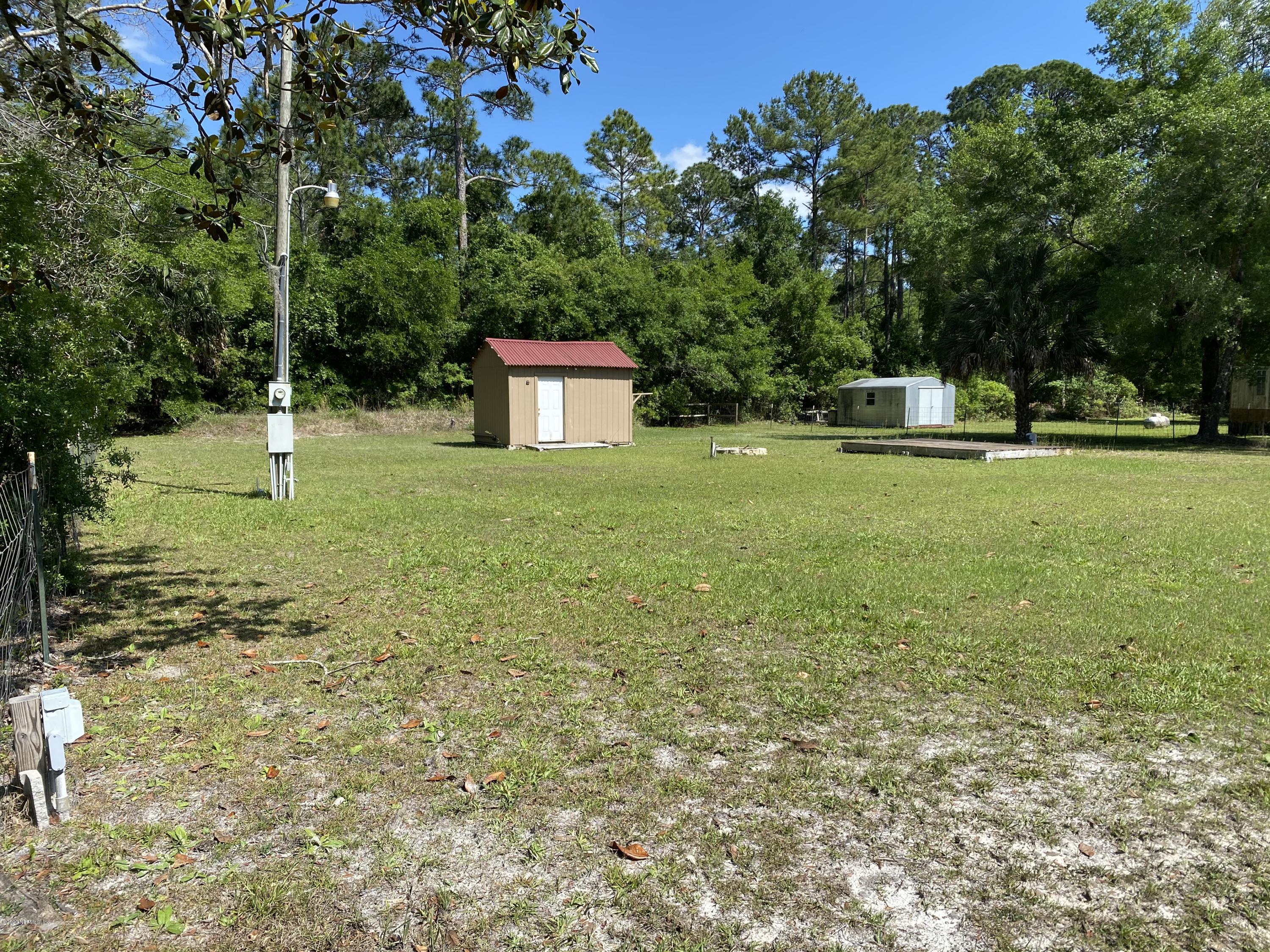 408 1st Street Steinhatchee, FL 32359 - Photo 2 of 6 a fire hydrant in the middle of a field