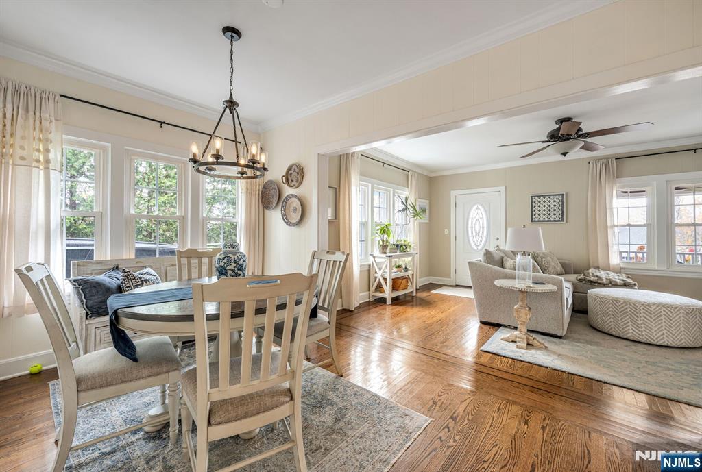203 Long Pond Road West Milford, NJ 07421 - Photo 12 of 50 a view of a dining room and livingroom with furniture wooden floor a chandelier