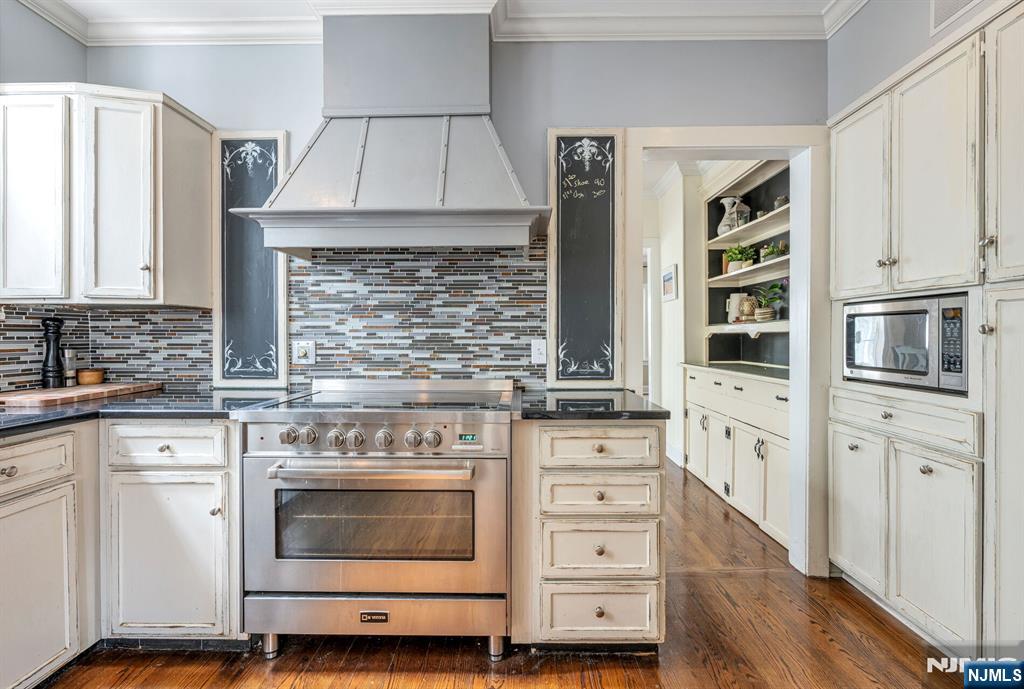 203 Long Pond Road West Milford, NJ 07421 - Photo 15 of 50 a kitchen with stainless steel appliances white cabinets and a stove top oven