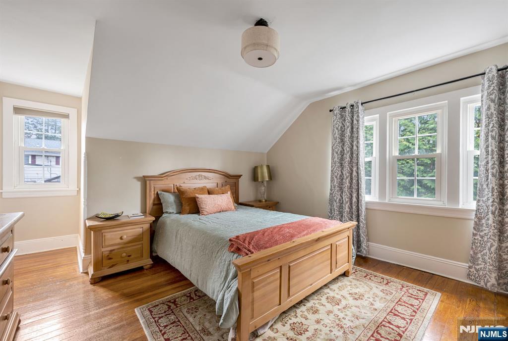 203 Long Pond Road West Milford, NJ 07421 - Photo 36 of 50 a bedroom with a bed and wooden floor