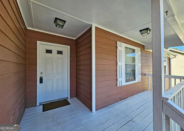 a view of front door and wooden floor