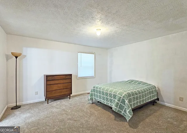 a bedroom with a bed and a cabinets