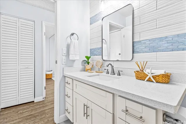 a bathroom with a sink and a mirror