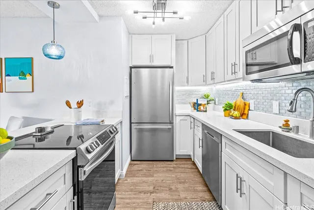 a kitchen with a sink and refrigerator