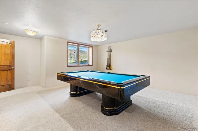 a bathroom with a toilet a sink and a mirror